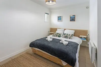 Un ou plusieurs lits dans un hébergement de l'établissement Appartement Face Mer
