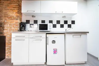Cuisine ou kitchenette dans l'établissement T3 Duplex de charme au cœur du quartier historique
