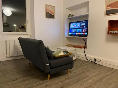 Télévision ou salle de divertissement dans l'établissement L'appart du cœur de bourg