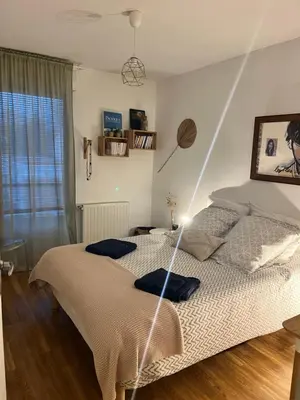 Un ou plusieurs lits dans un hébergement de l'établissement Cosy Room