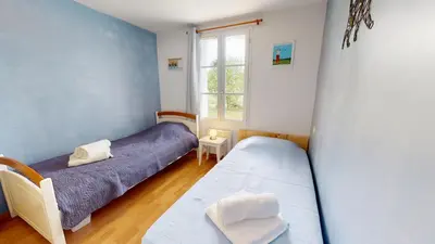 Un ou plusieurs lits dans un hébergement de l'établissement Le Cottage des Fontenelles