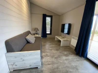 Coin salon dans l'établissement Chalet pour 5 - Piscine couverte - St Hilaire