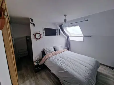 Un ou plusieurs lits dans un hébergement de l'établissement Charmant duplex à 500 m de la plage