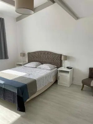 Un ou plusieurs lits dans un hébergement de l'établissement Belle maison quartier calme proche plage mer