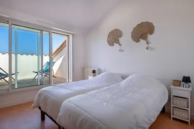 Un ou plusieurs lits dans un hébergement de l'établissement Face Mer - Bel appartement pour 4