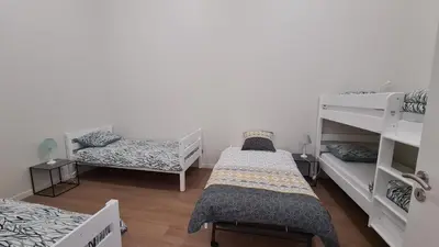 Un ou plusieurs lits dans un hébergement de l'établissement Gîte Le Puy Martineau piscine privée intérieure chauffée terrain arboré à 10 min du Puy du Fo