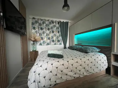 Un ou plusieurs lits dans un hébergement de l'établissement Appartement à 100m de la plage