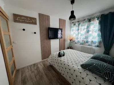 Un ou plusieurs lits dans un hébergement de l'établissement Appartement à 100m de la plage