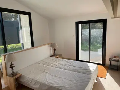 Un ou plusieurs lits dans un hébergement de l'établissement Maison en bord de rivière de mer