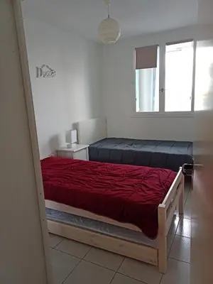 Un ou plusieurs lits dans un hébergement de l'établissement APPARTEMENT BORD DE MER