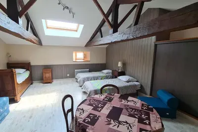 Un ou plusieurs lits dans un hébergement de l'établissement Chez Lili Maison de campagne gîte familial