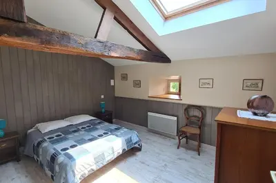 Un ou plusieurs lits dans un hébergement de l'établissement Chez Lili Maison de campagne gîte familial