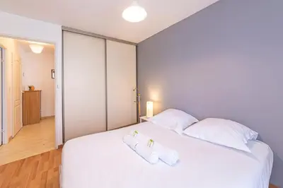 Un ou plusieurs lits dans un hébergement de l'établissement Le Galilée - Wifi - Balcon