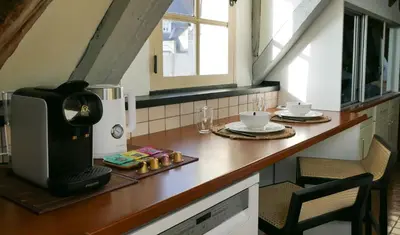 Cuisine ou kitchenette dans l'établissement Suite Toussaint - Calme & Authentique