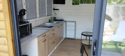 Cuisine ou kitchenette dans l'établissement L escale jardin