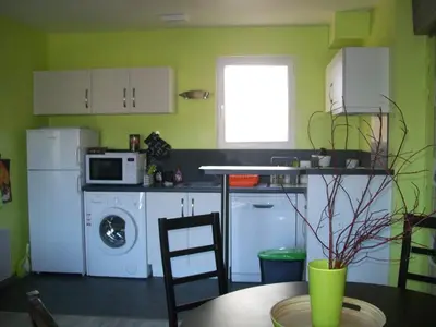 Cuisine ou kitchenette dans l'établissement Au Jardin d'Eau