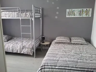 Un ou plusieurs lits dans un hébergement de l'établissement Maison avec jardin- Cholet - 20 mn du puy du fou