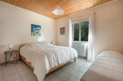 Un ou plusieurs lits dans un hébergement de l'établissement Maison Dune et Forêt à 100m de la mer