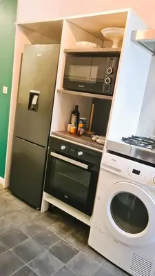 Cuisine ou kitchenette dans l'établissement L'Haussmannien