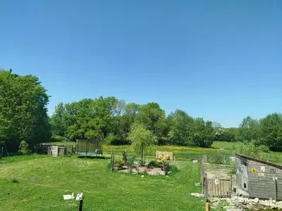 Jardin de l'établissement Maisonnette de charme A 5 min du Parc PUYDUFOU