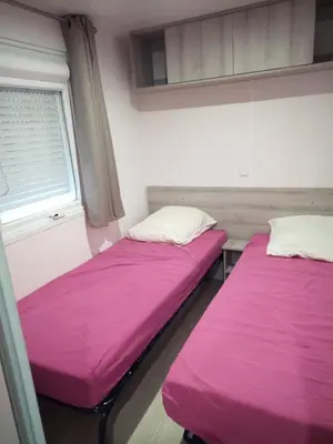 Un ou plusieurs lits dans un hébergement de l'établissement Mobil-home tout confort à 300m de l'océan