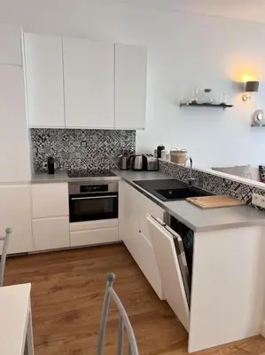 Cuisine ou kitchenette dans l'établissement Le Pawlina