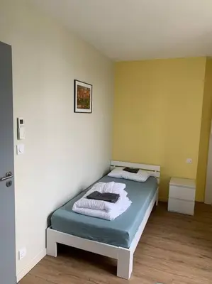 Un ou plusieurs lits dans un hébergement de l'établissement Appartement Sakura - Maulévrier Cholet Puy du Fou