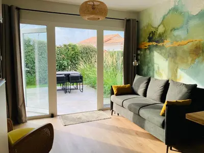 Coin salon dans l'établissement Le Clos de Jade - Appt 3 étoiles avec piscine partagée