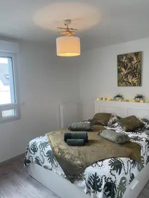 Un ou plusieurs lits dans un hébergement de l'établissement Villa des Cerisiers