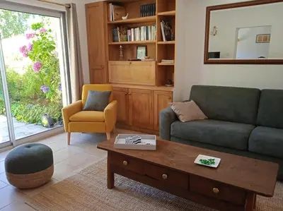 Coin salon dans l'établissement Cottage spacieux Domaine de la Bretesche