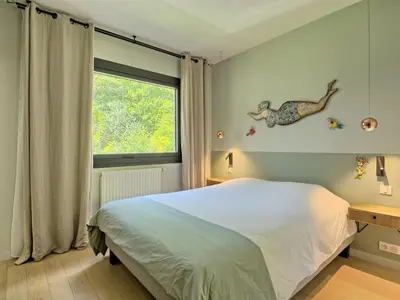 Un ou plusieurs lits dans un hébergement de l'établissement Holiday Home La Rose des Sables by Interhome