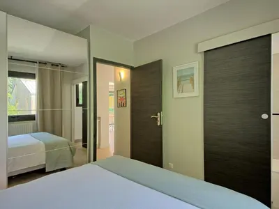 Un ou plusieurs lits dans un hébergement de l'établissement Holiday Home La Rose des Sables by Interhome