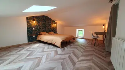 Un ou plusieurs lits dans un hébergement de l'établissement Appartement au calme