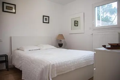 Un ou plusieurs lits dans un hébergement de l'établissement Maison de vacances bord de mer