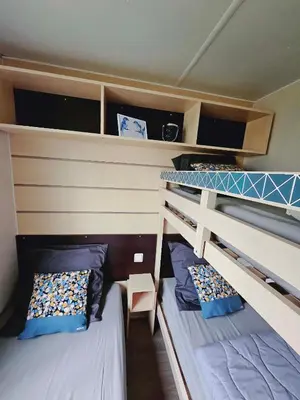 Un ou plusieurs lits dans un hébergement de l'établissement Bungalow Cosy équipé