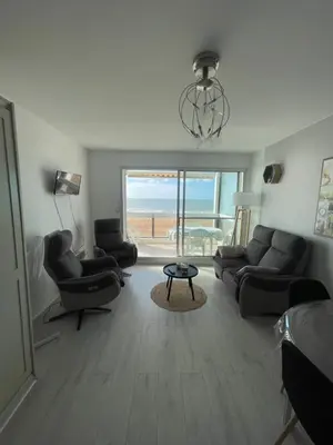 Coin salon dans l'établissement Appartement avec vue mer
