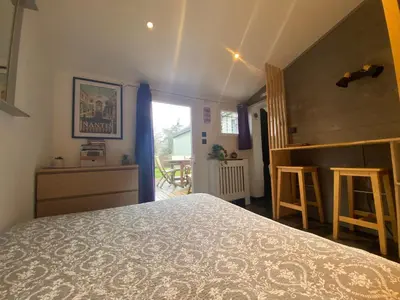 Un ou plusieurs lits dans un hébergement de l'établissement Le nid Nantais studio cosy à Nantes, parc - expo , stade La Beaujoire