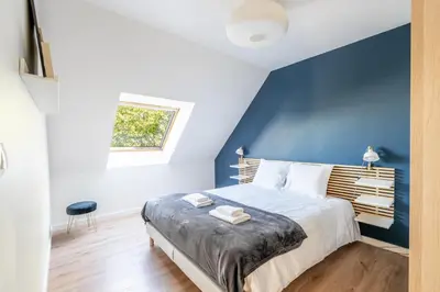 Un ou plusieurs lits dans un hébergement de l'établissement Le coin des Songes - Maison avec jardin