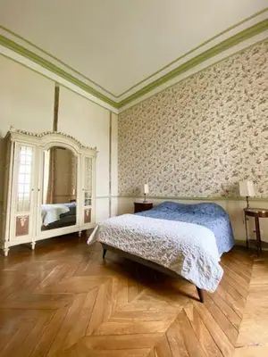 Un ou plusieurs lits dans un hébergement de l'établissement La Chambre Verte - Château de la Chauvelière
