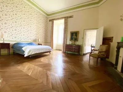 Un ou plusieurs lits dans un hébergement de l'établissement La Chambre Verte - Château de la Chauvelière