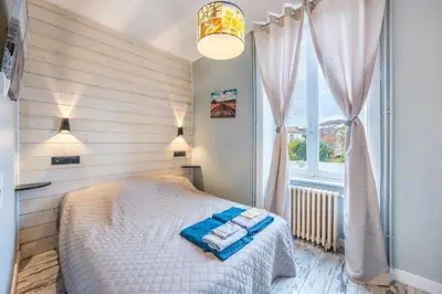Un ou plusieurs lits dans un hébergement de l'établissement Chambre Rêve américain