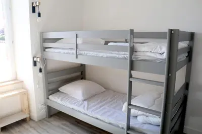 Un ou plusieurs lits dans un hébergement de l'établissement Le gîte de Kelly