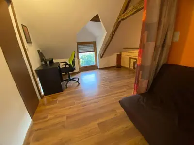 Télévision ou salle de divertissement dans l'établissement La maison paisible
