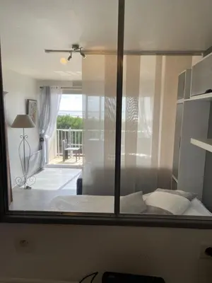 Un ou plusieurs lits dans un hébergement de l'établissement Appartement Studio 35 m2 face à l'Ocean
