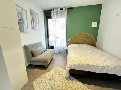 Un ou plusieurs lits dans un hébergement de l'établissement Studio indépendant et cosy