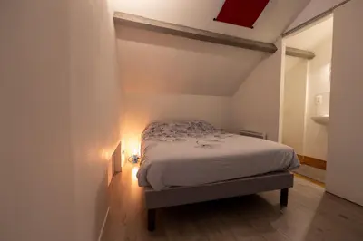 Un ou plusieurs lits dans un hébergement de l'établissement Gites de La Gare - Le Studio