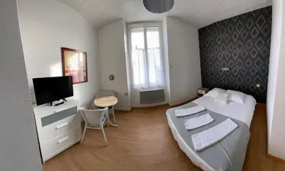 Un ou plusieurs lits dans un hébergement de l'établissement Hôtel de Nantes