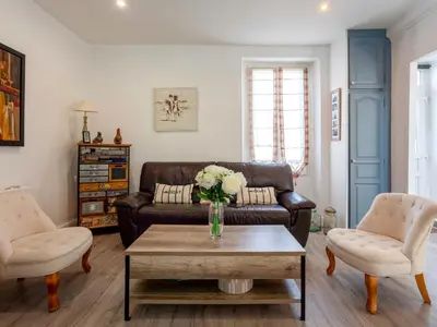 Coin salon dans l'établissement Holiday Home Le Bain du Papillon by Interhome