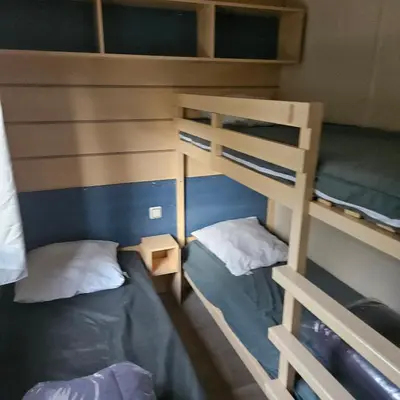 Un ou plusieurs lits dans un hébergement de l'établissement MH-MAUFAY -- Mobil-Home -- Puy du Fou - 30 min