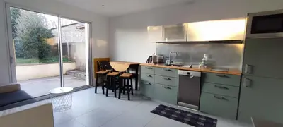 Cuisine ou kitchenette dans l'établissement Joli appartement proche forêt et centre-ville